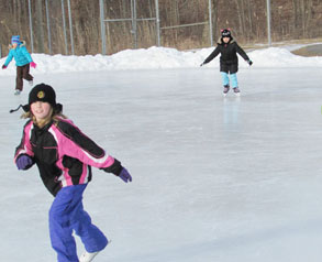 girl skates at ice rink