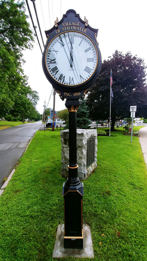 big clock on a post