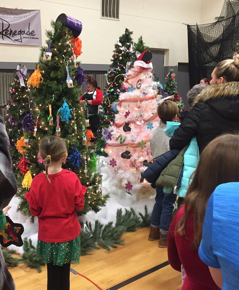children decorate christmas trees